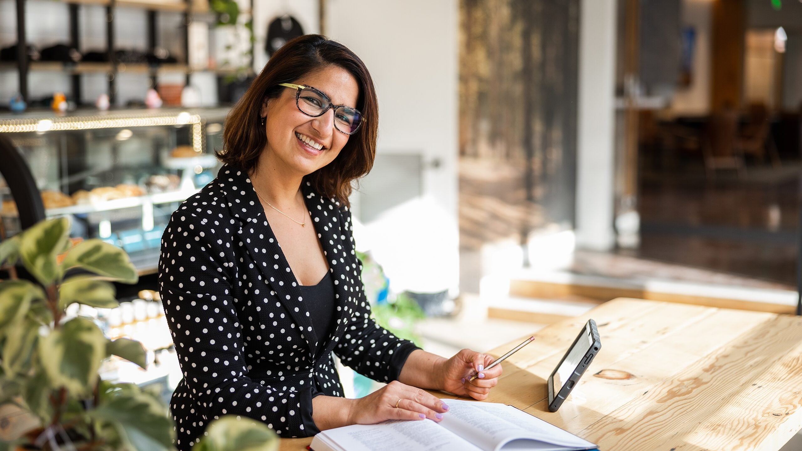 Woman does coursework in her home office.